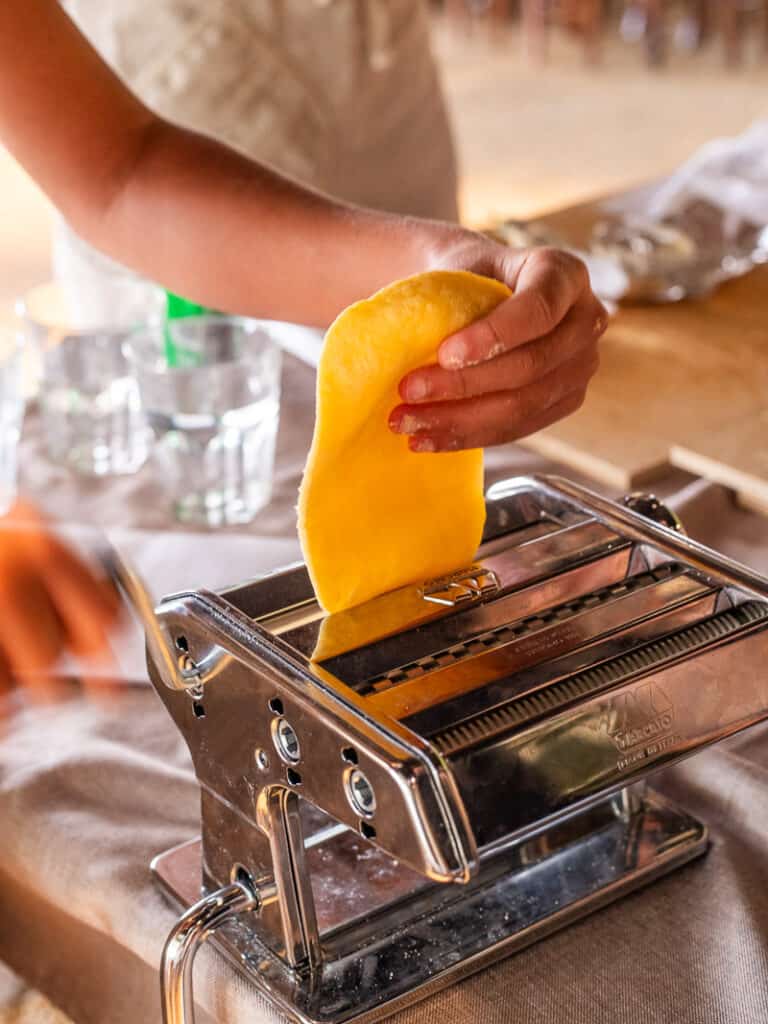 person making pasta