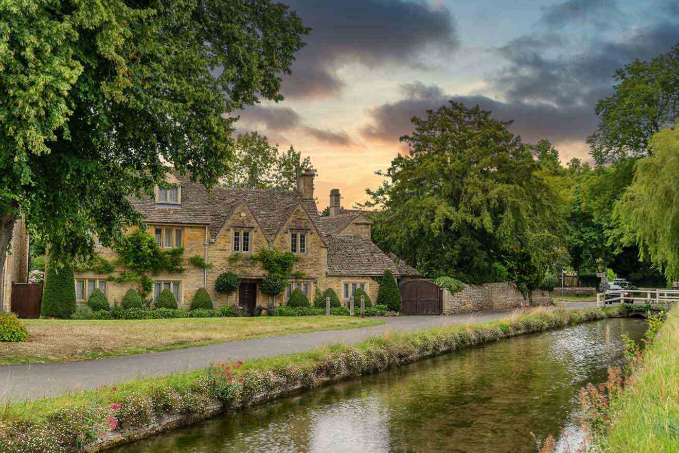 street with houses by a river at sunset