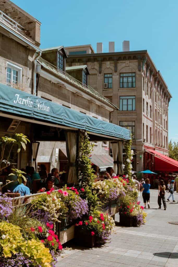 Old Montreal restaurant patio with flower boxes