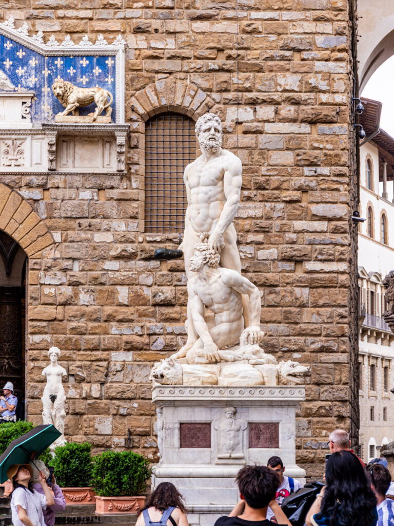 marble statue of Hercules and Cacus outside building