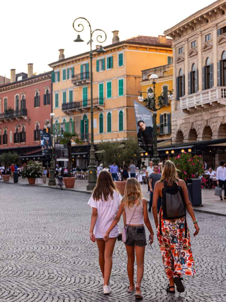 caz and girls walking across piazza bra