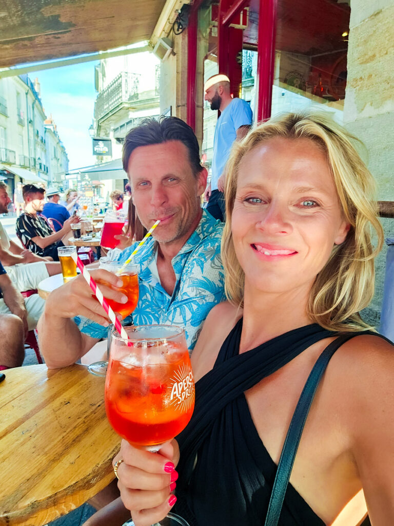 caz and craig drinking aperol spritz