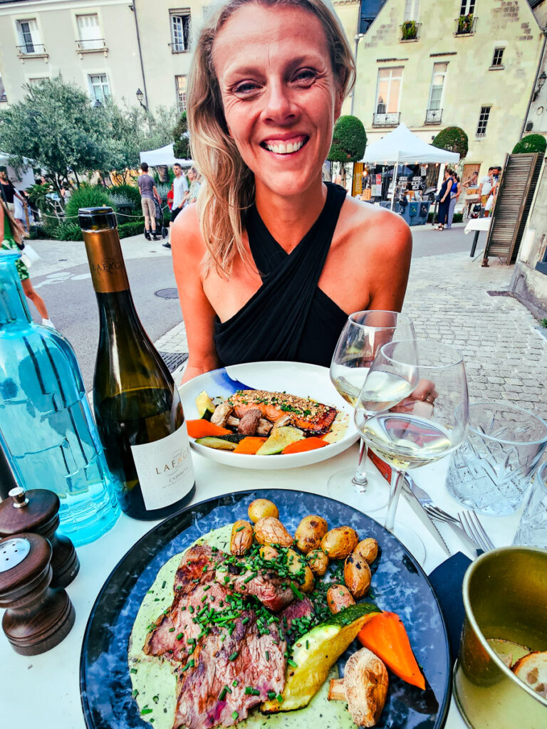 caz smiling at restaurant table