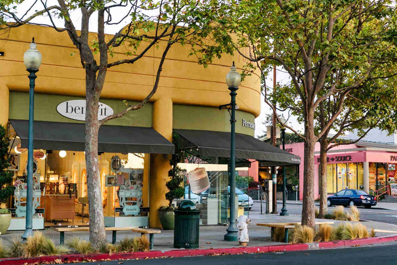 A yellow building with a yellow awning on the side of the street.