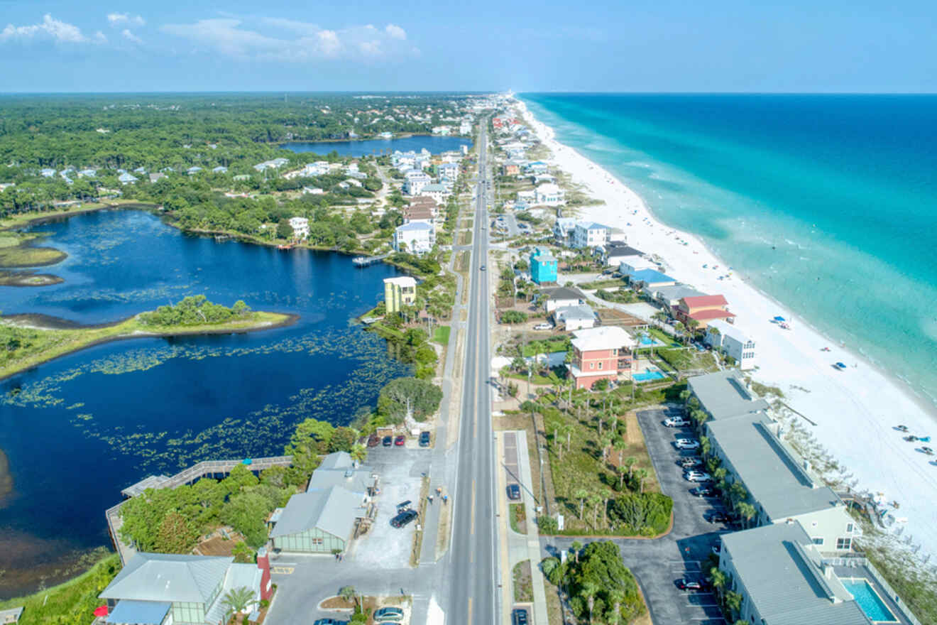 An aerial view of a beach road and ocean.