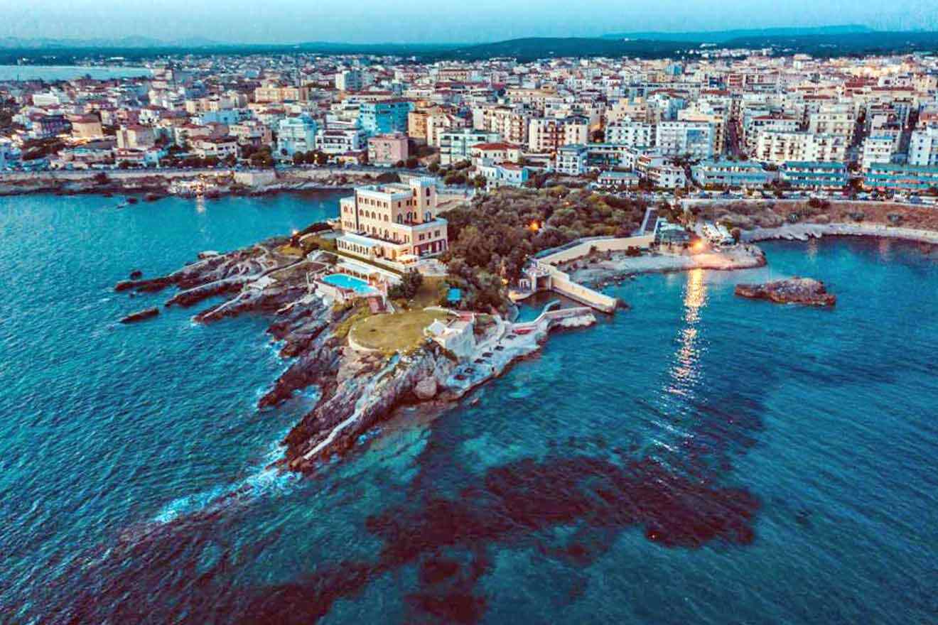 An aerial view of a city surrounded by the sea