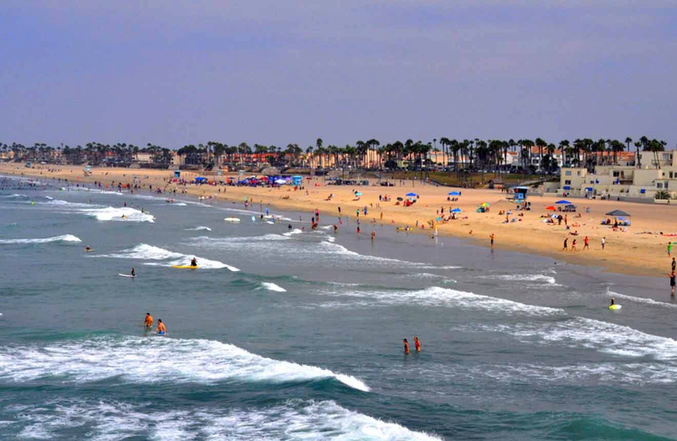 A beach with a lot of people on it.