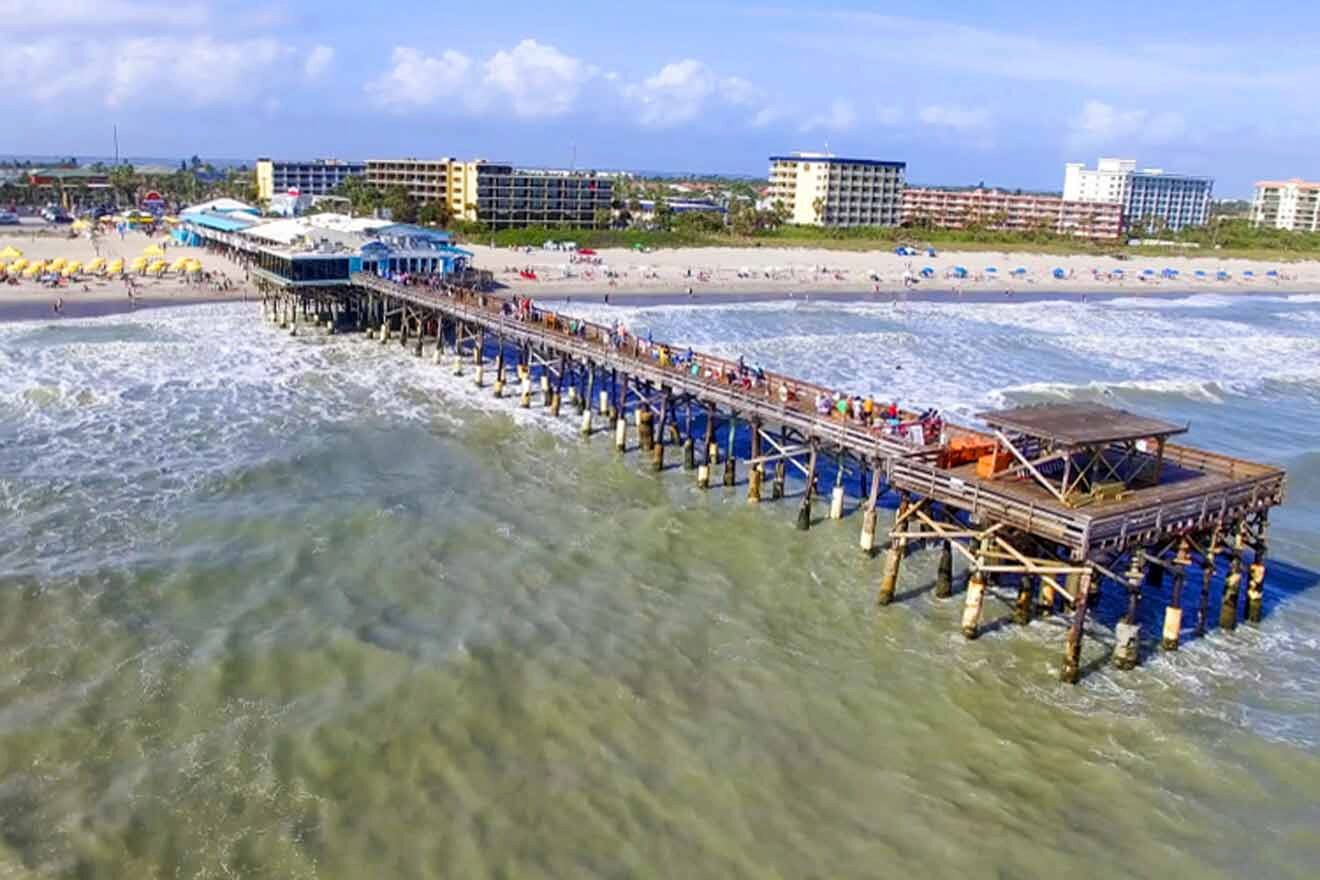 An aerial view of a pier with people on it.