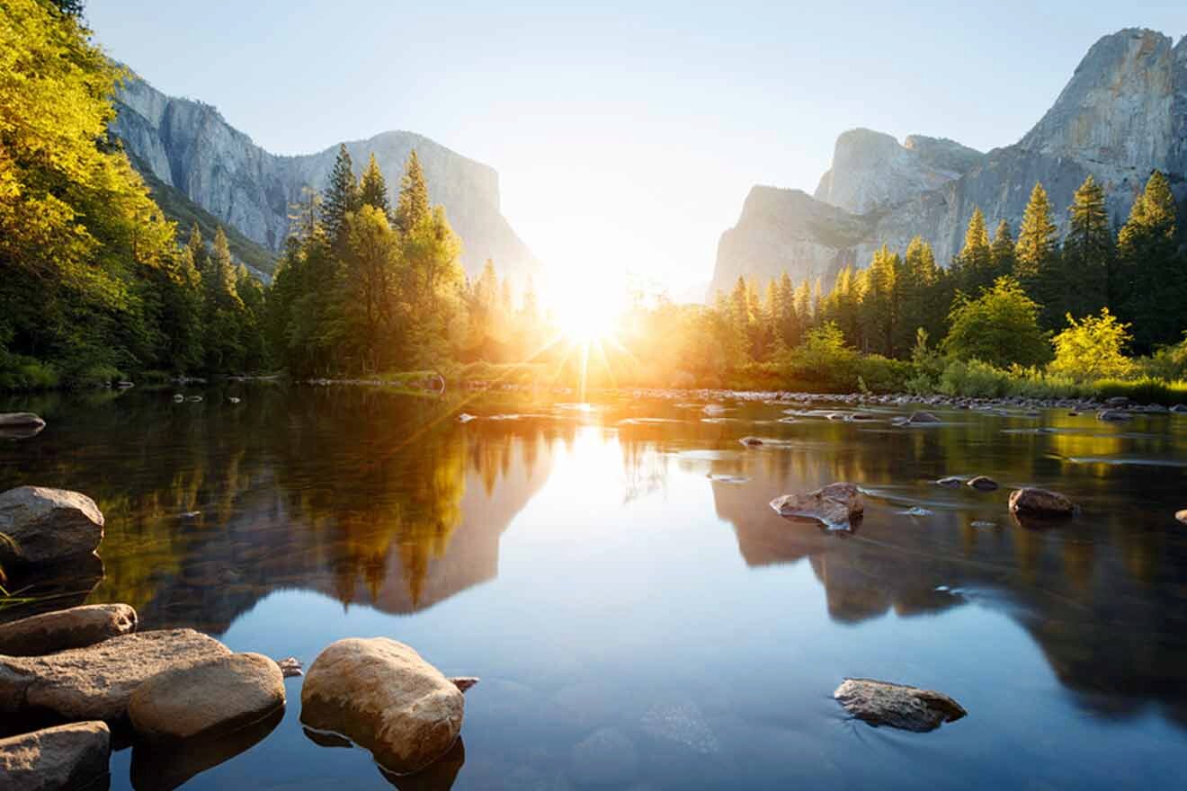 lake with rocks and trees in the background at sunset