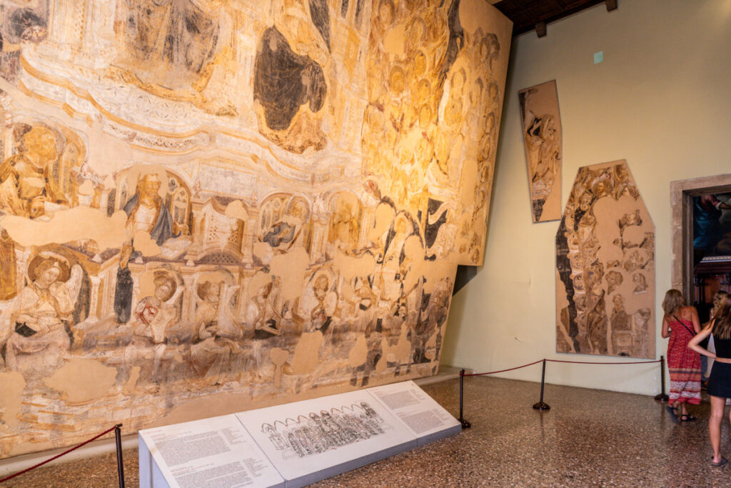 people walking past exhibit