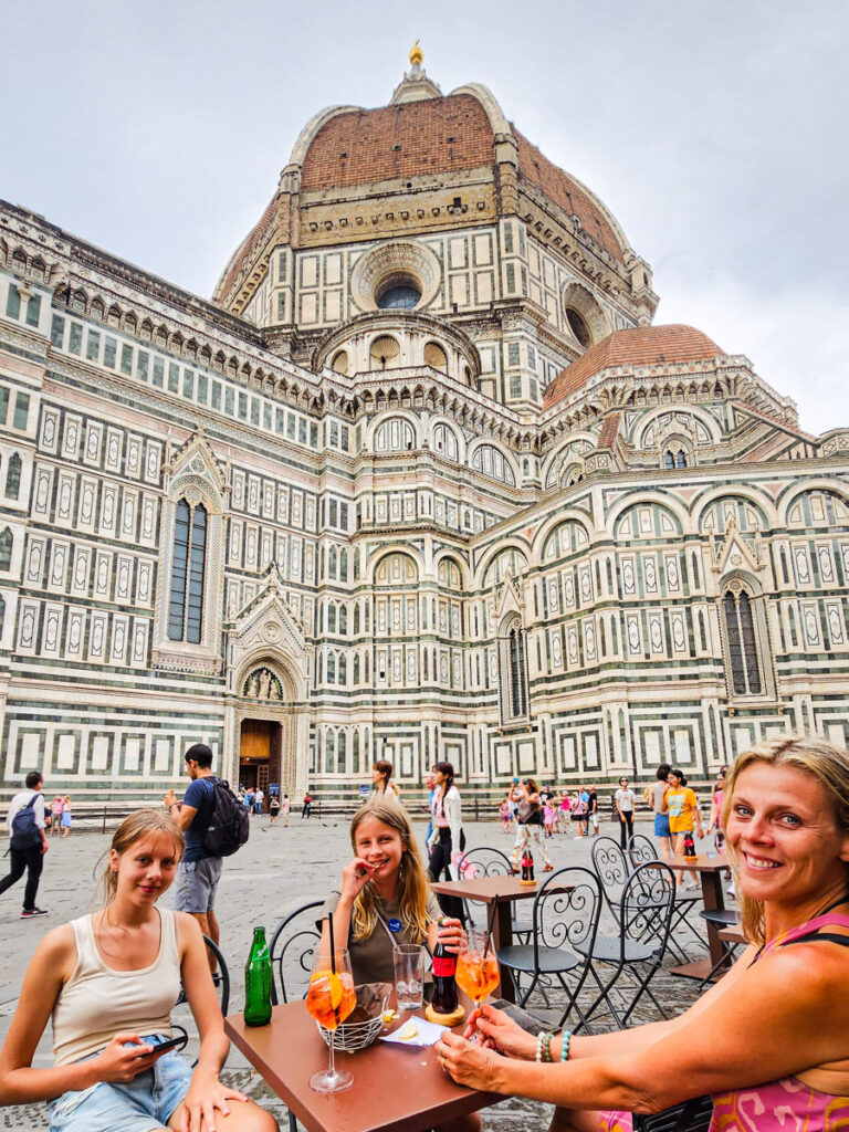 caz and girls sitting in front of duomo