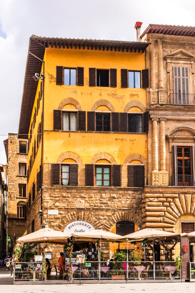 people sitting outside restaurant