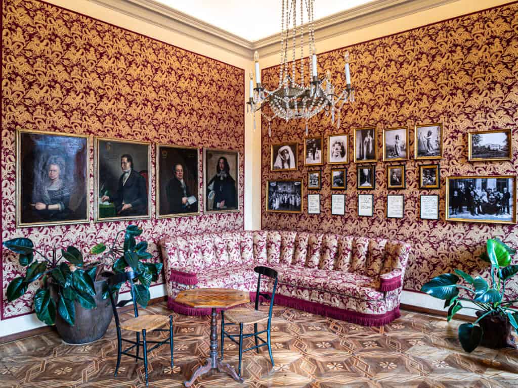 red couch and wallpaper in living room