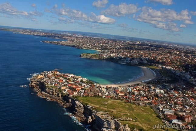 coastline of sydney with houses on it viewed from above