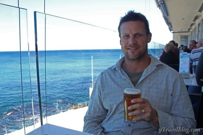 craig with beer at table with view