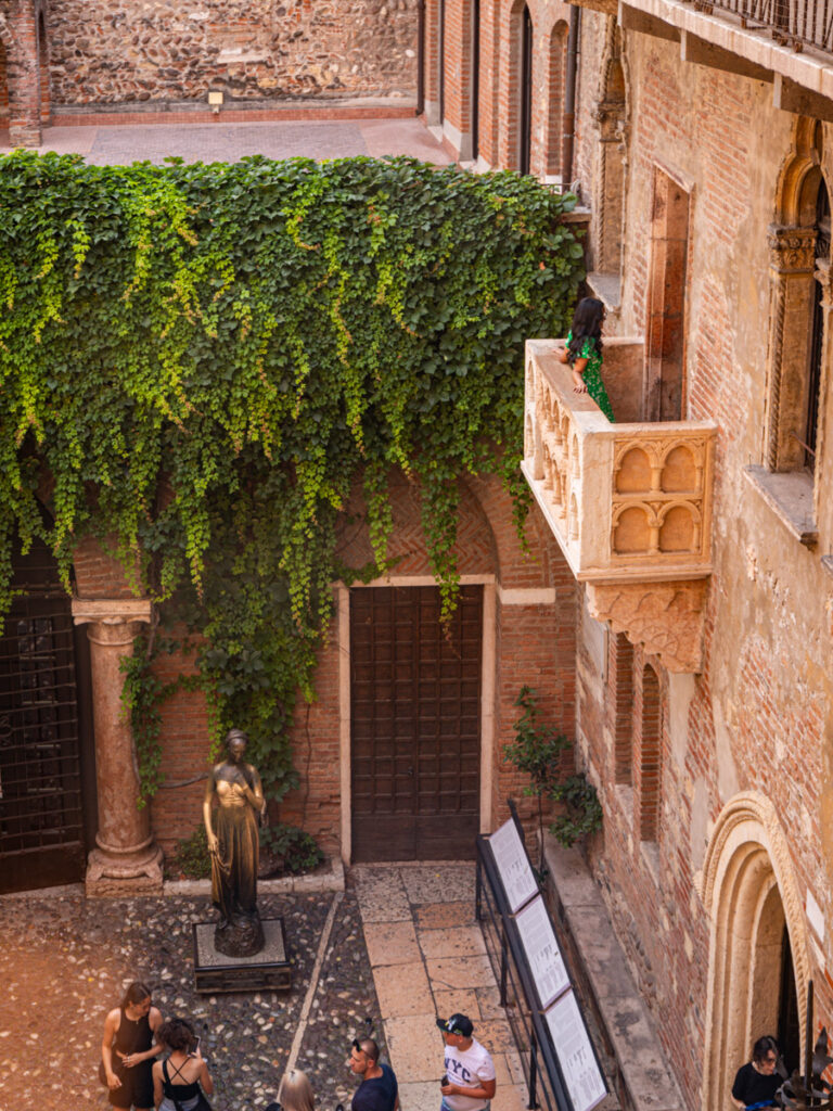 someone standing on Juliette's balcony overlooking courtyard