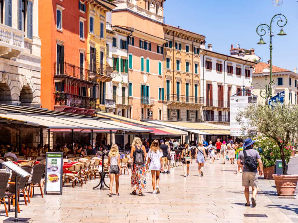 people walking through Piazza Bra