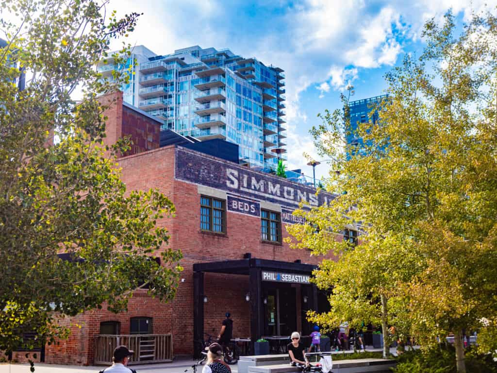 brick exterior of the simmons building framed by trees