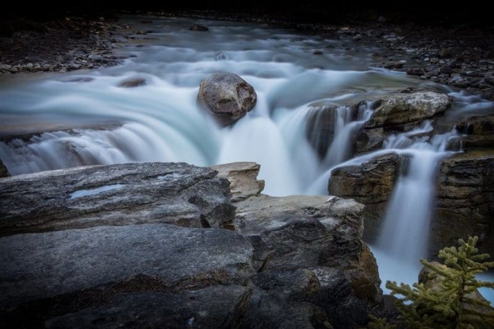 water streaming over rock face