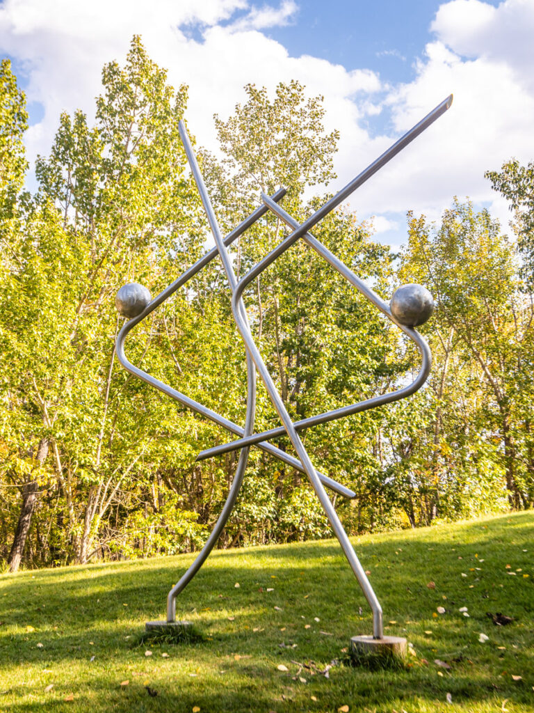 steel intertwined sculpture in park 