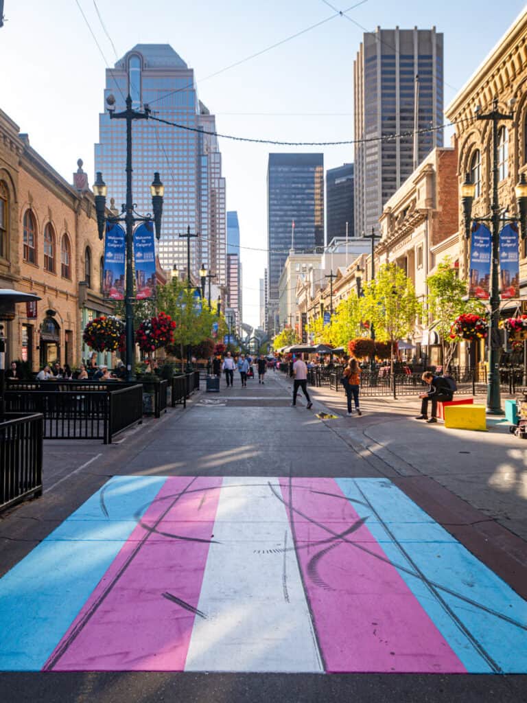 rainbow crossing on pedestrian stephen ave with high rises in backgroud