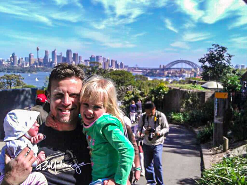 craig, kalyra and savannah posing in front of sydney skyline