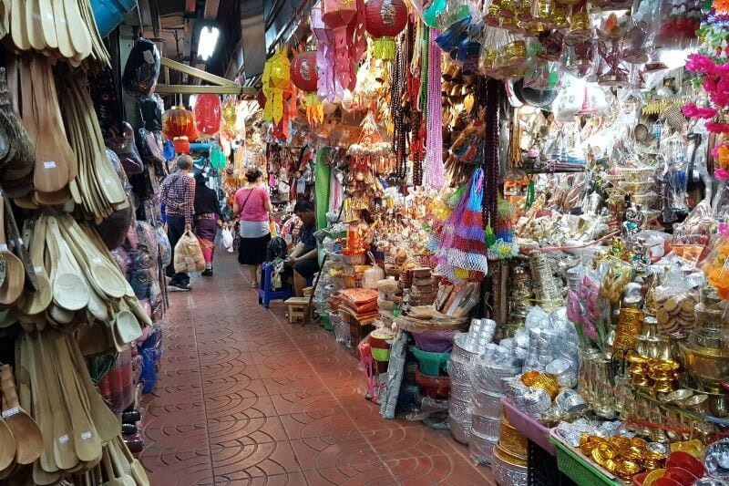 stalls of produce hanging up Warorot market Chiang Mai