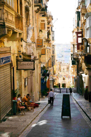 people walking on a city street 