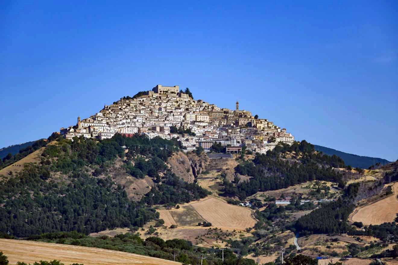 A small town sits on top of a hill.