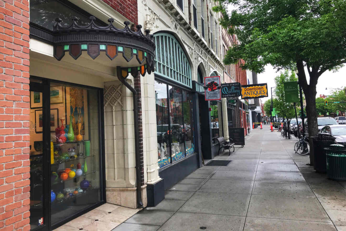 a street in a city with restaurants and shops