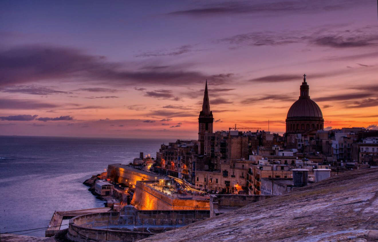 view of a city skyline at sunset