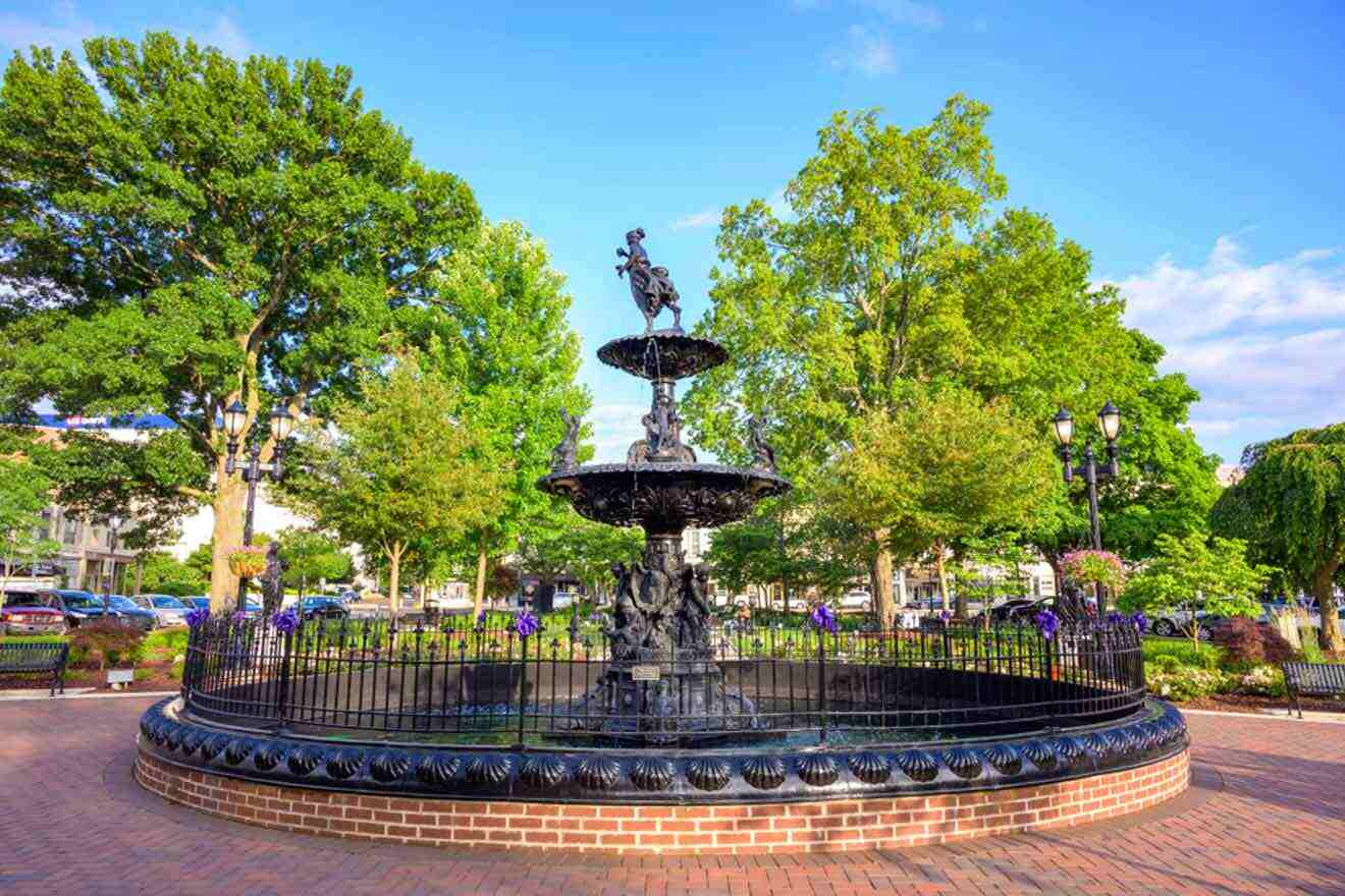 A fountain in the middle of a city square.