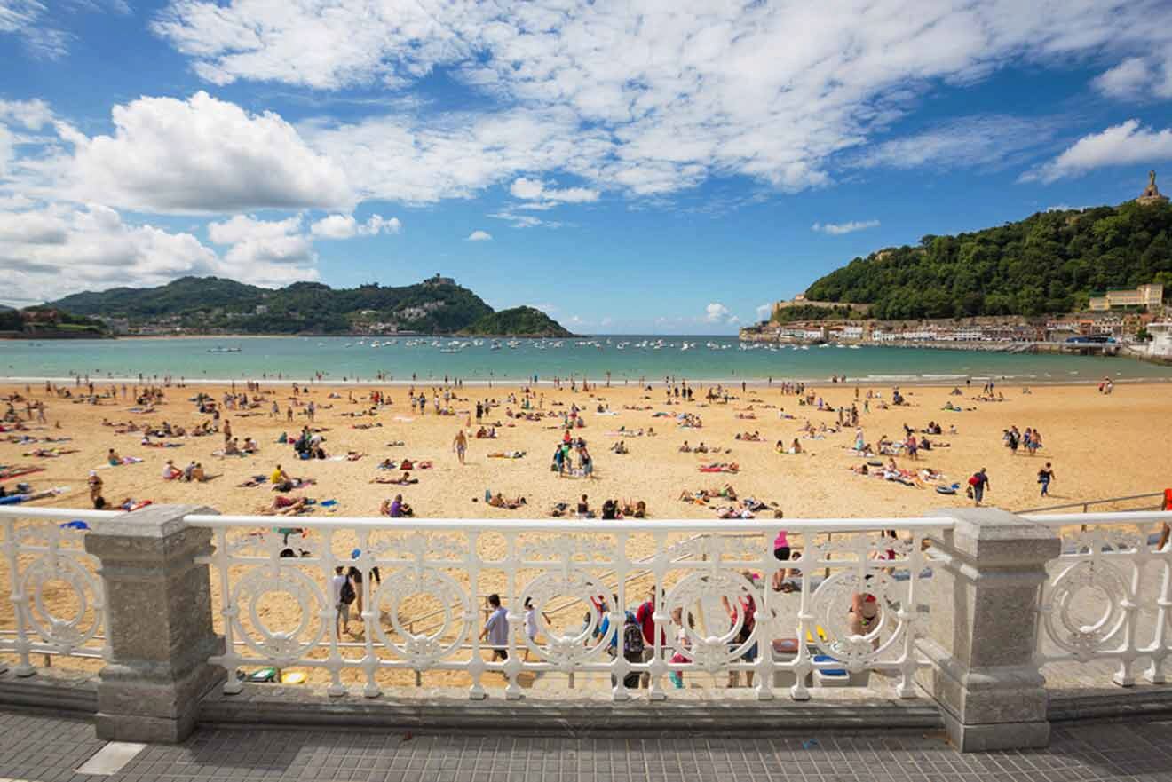 A beach with a lot of people on it.