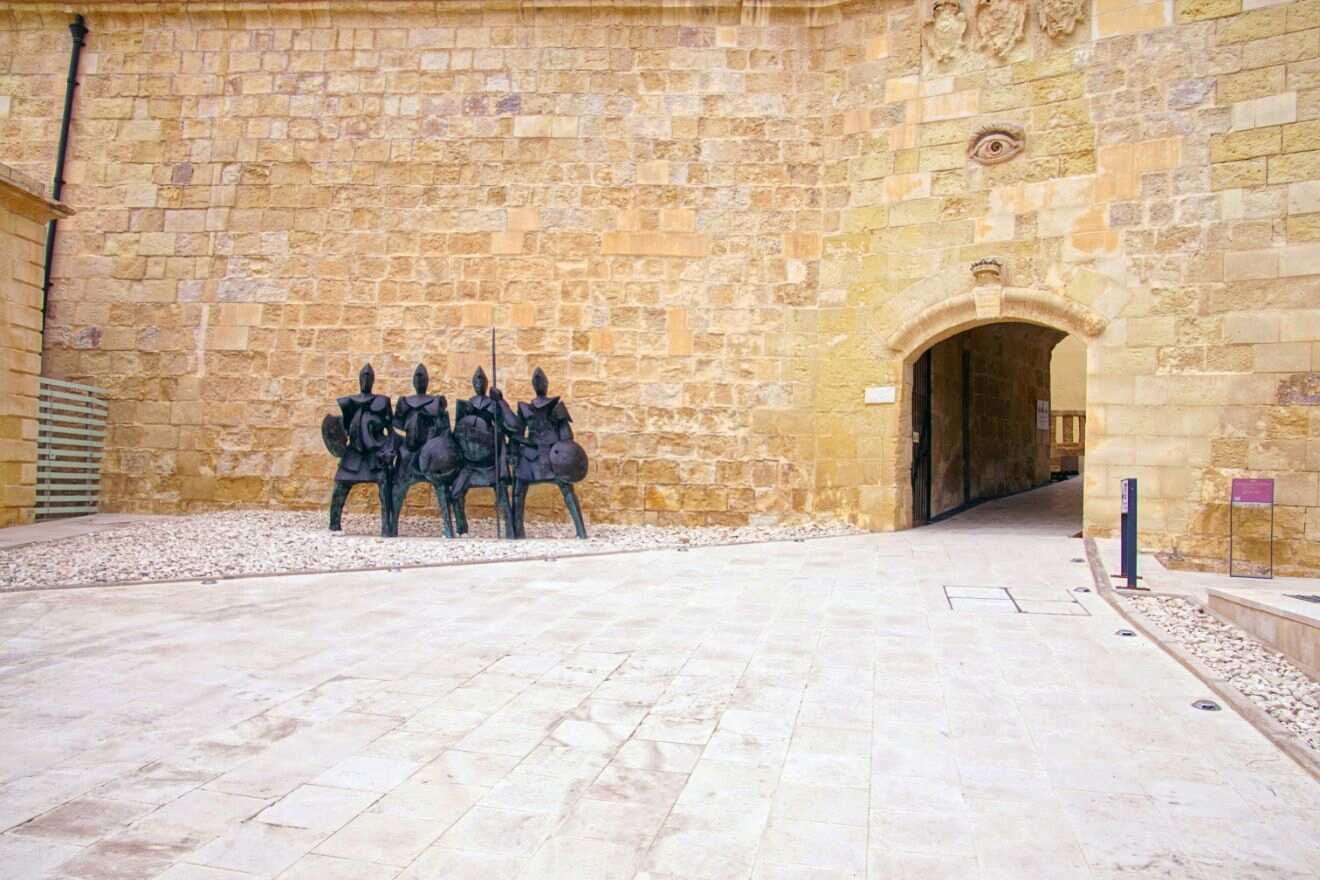 knights statues in front of a museum