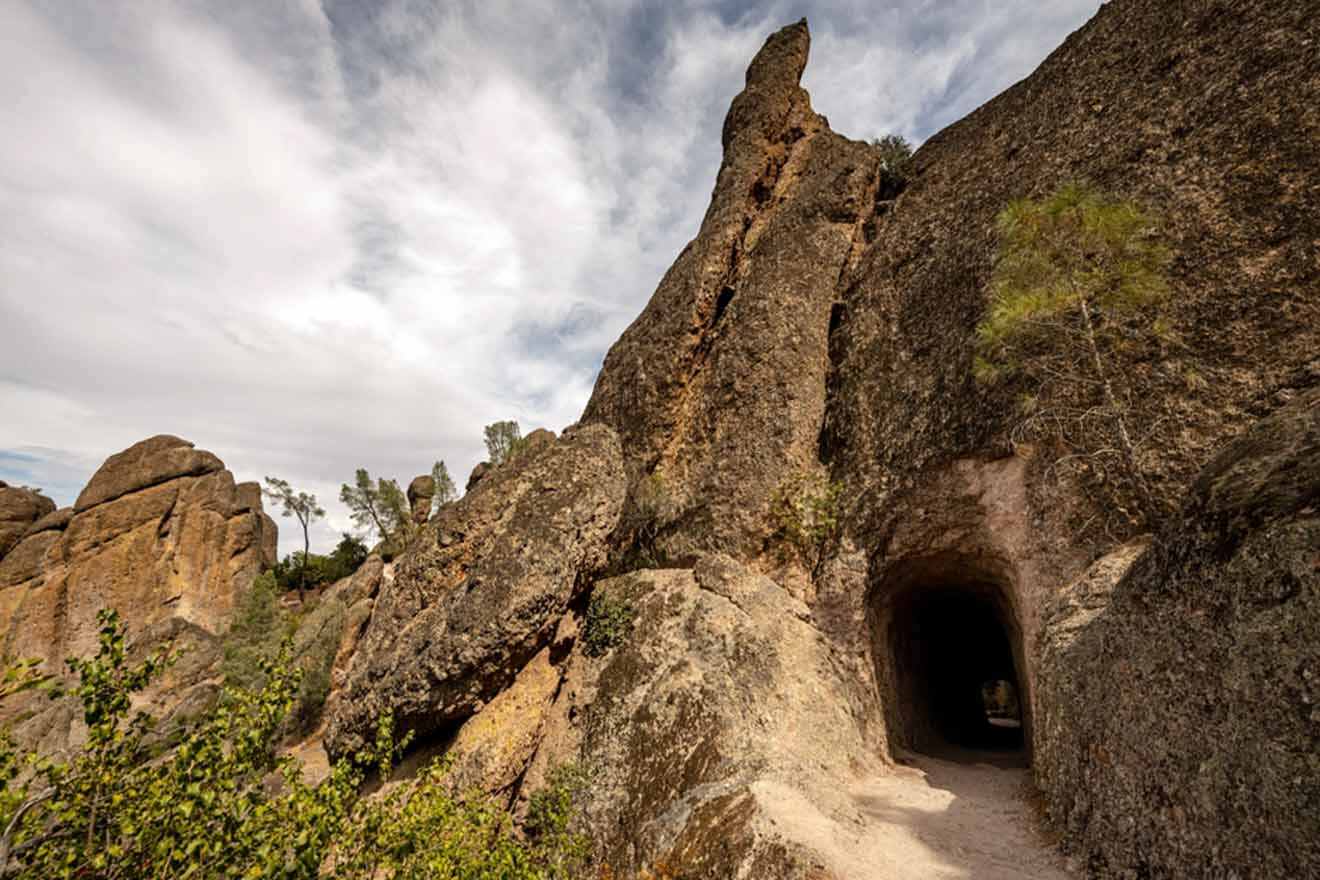 A path leading to a cave in a rock formation.