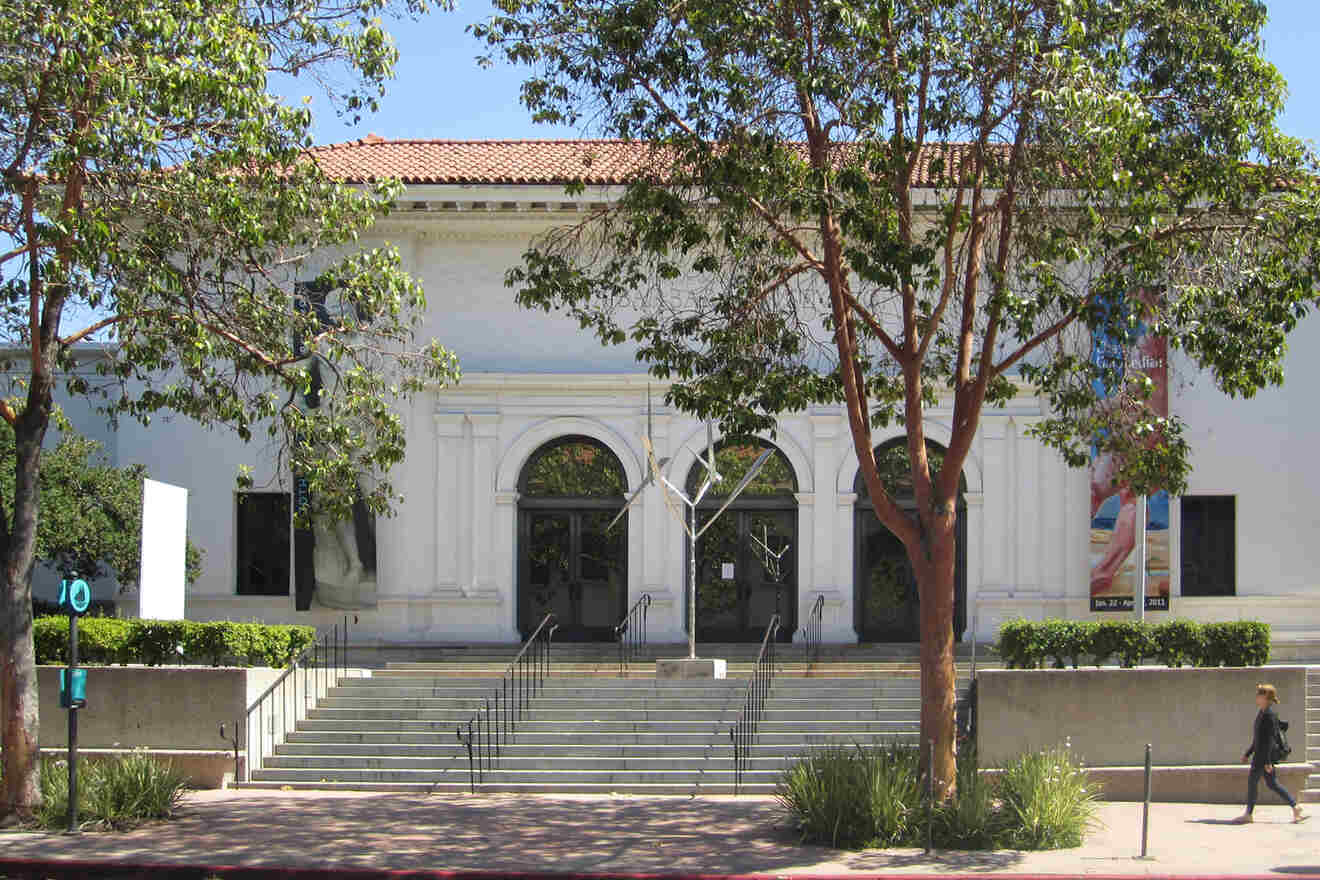 A white building with steps leading up to it.