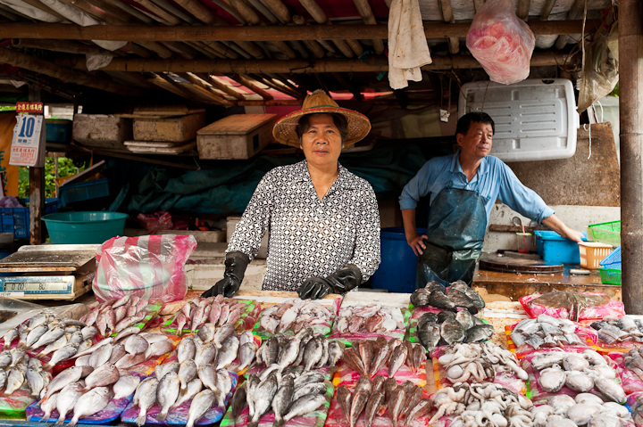 men working at a fish shop