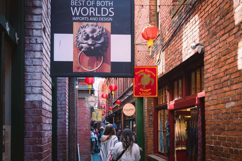 people walking through Chinatown Victoria BC