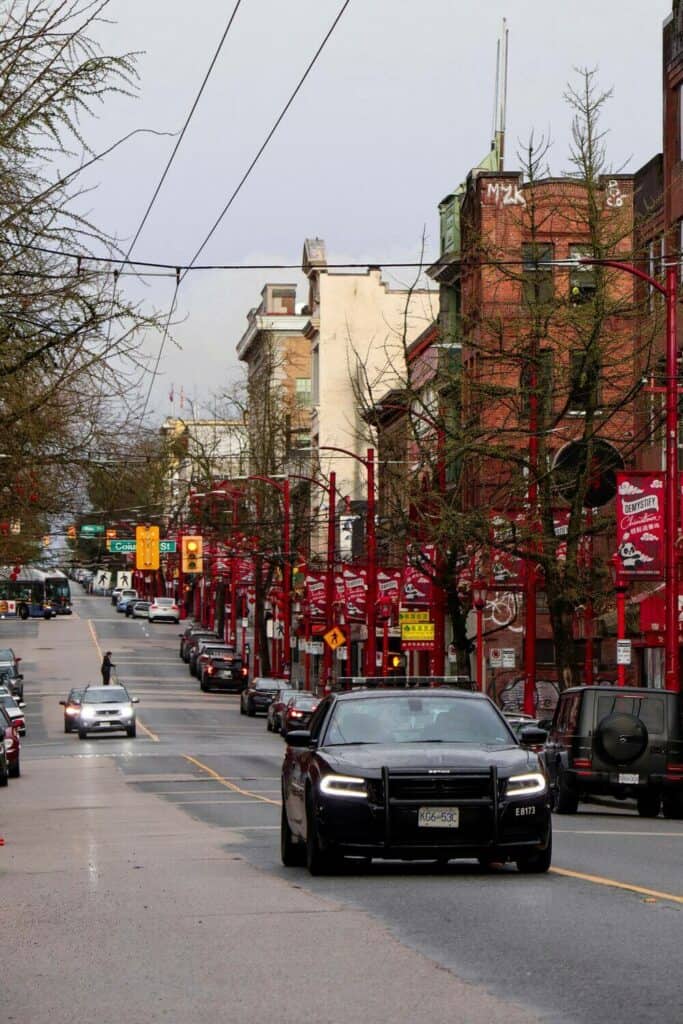 cars driving through Chinatown vancouver