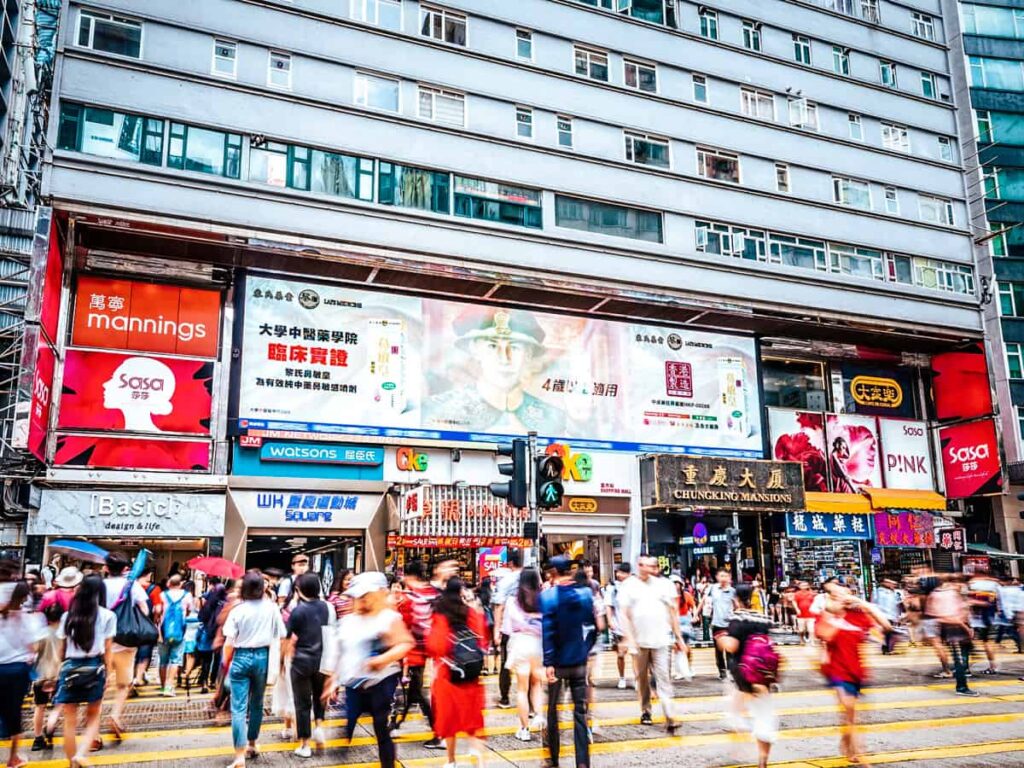 people walking around outside chungking mansion