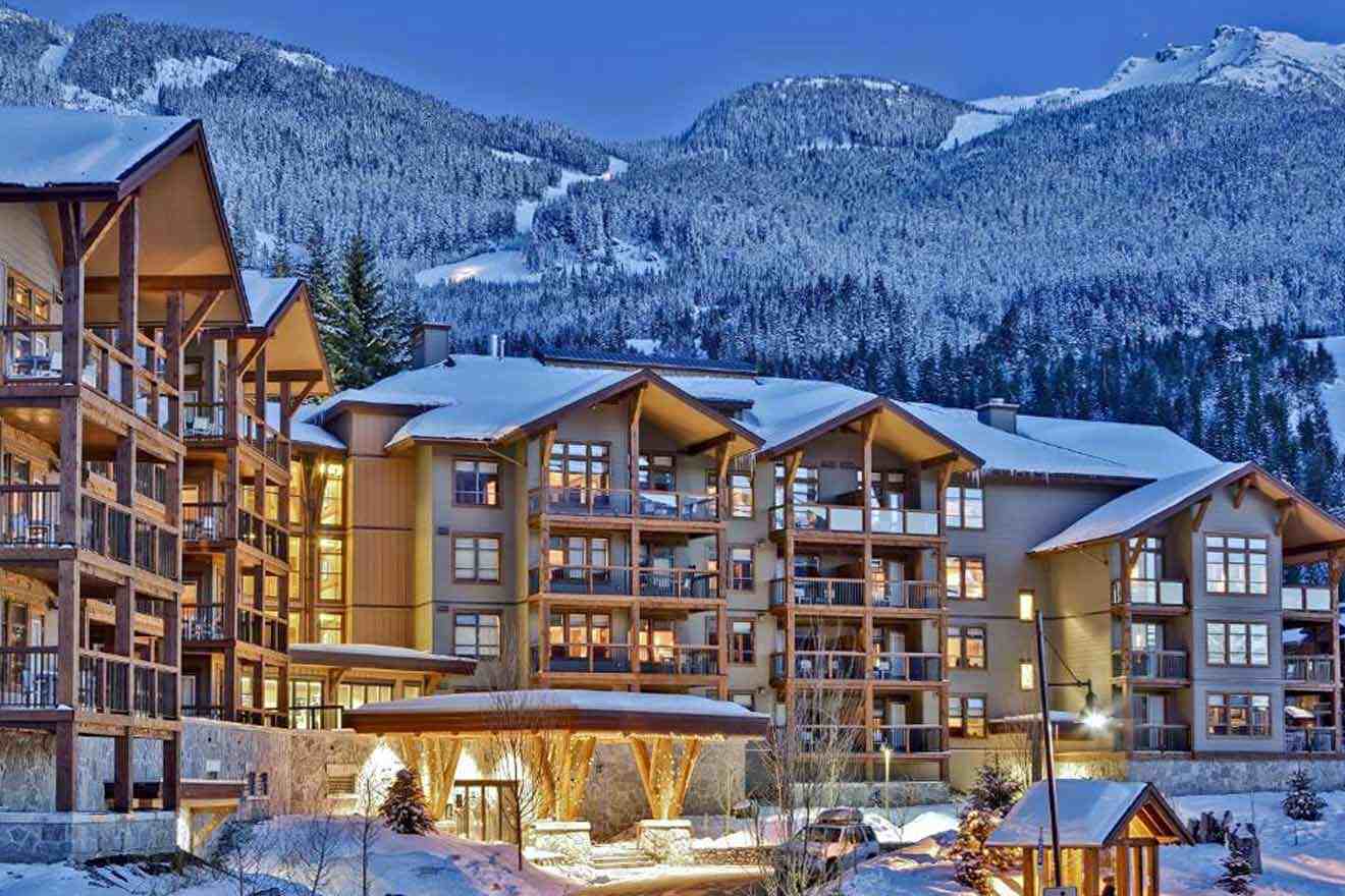 A resort in the mountains with snow on the ground.