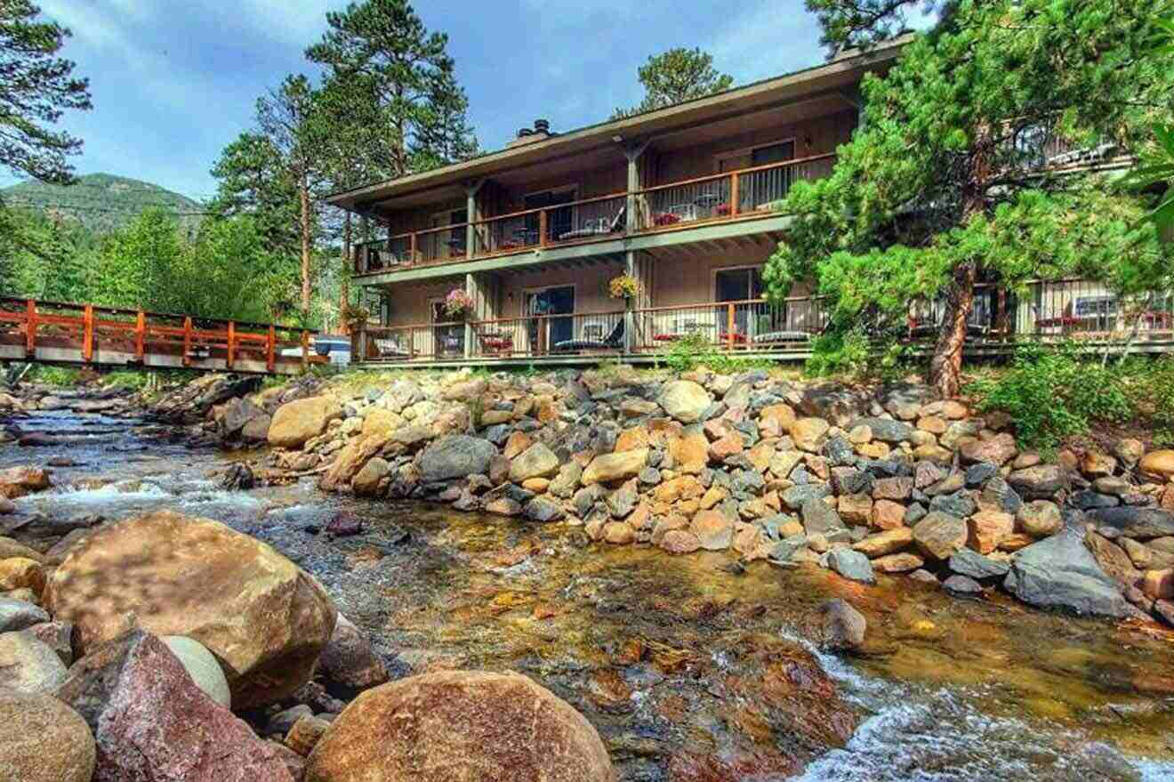 A building on rocks next to a stream