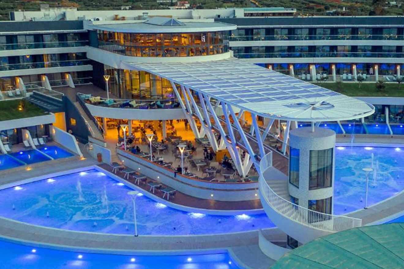 An aerial view of a hotel pool at dusk.