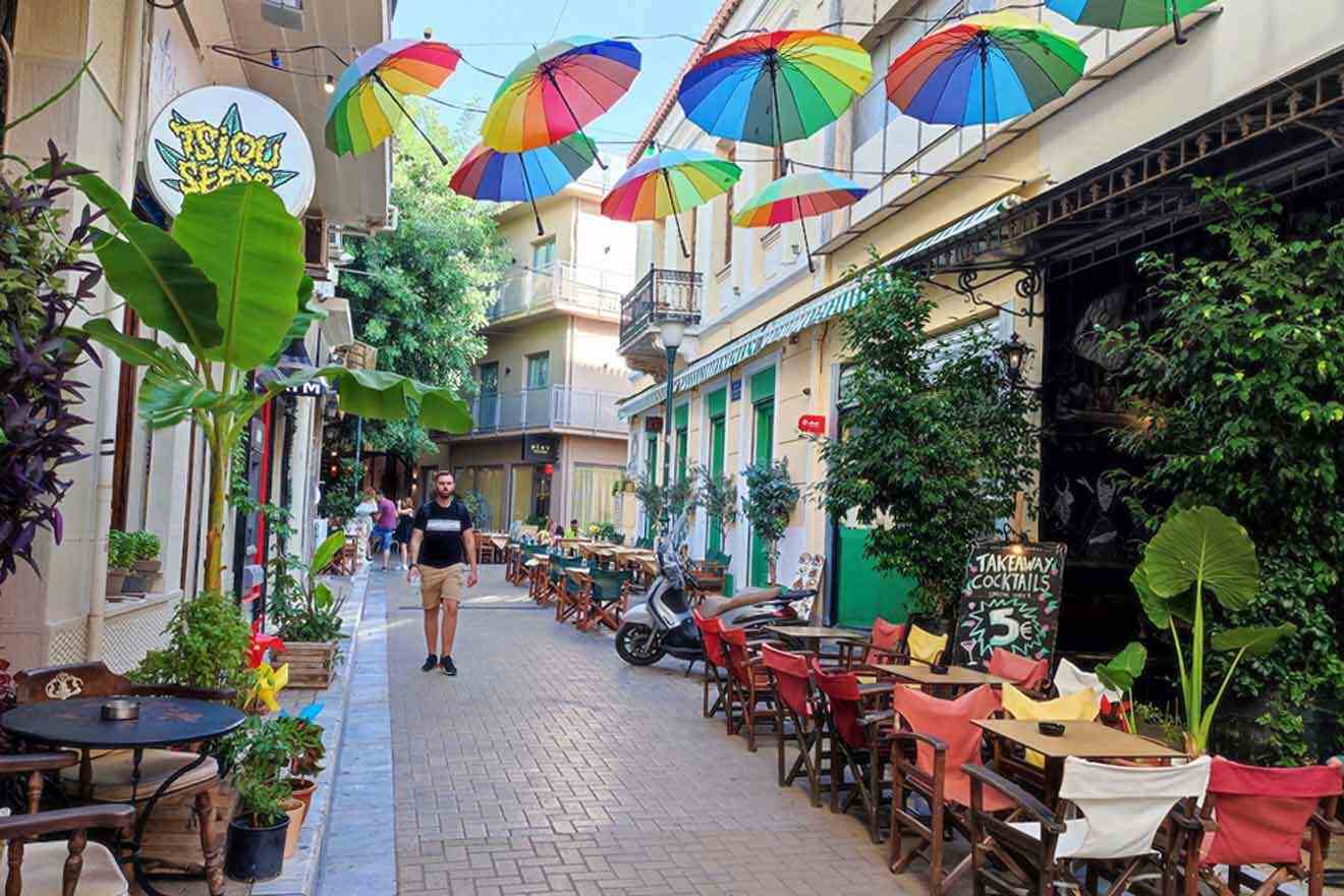 Colorful umbrellas hanging over a narrow alley.