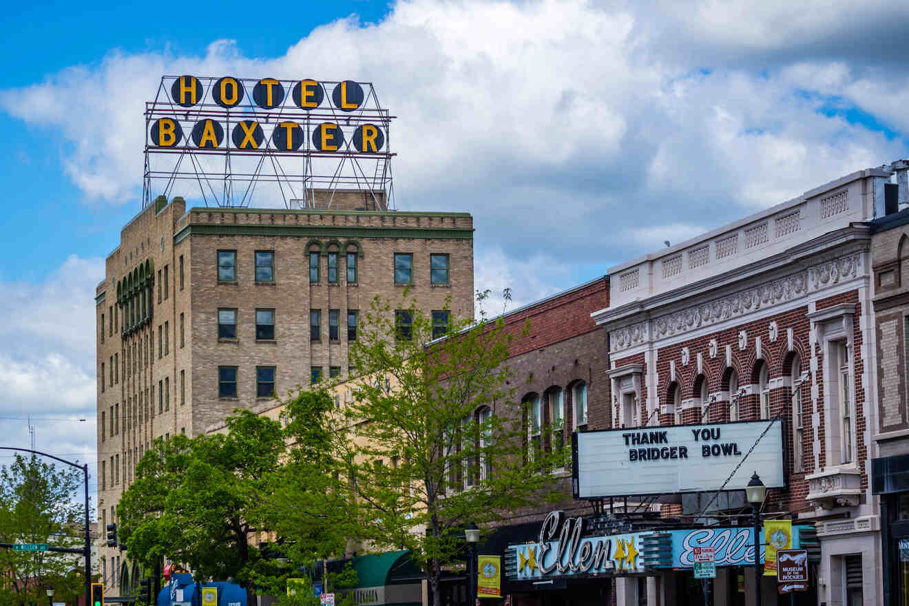 A city street with many buildings and a sign.