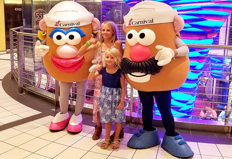 young girls posing with Carnival Vista characters