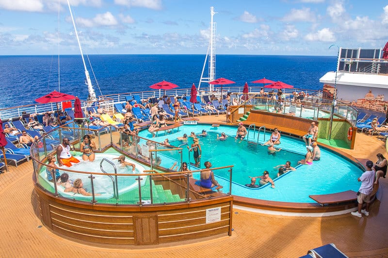 peopel swimming in pool on ocean cruise