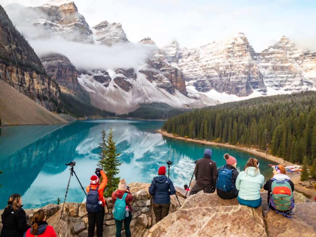 People sitting on rock looking at view