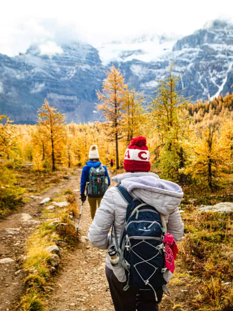 hikers on the larch valley trail in fall