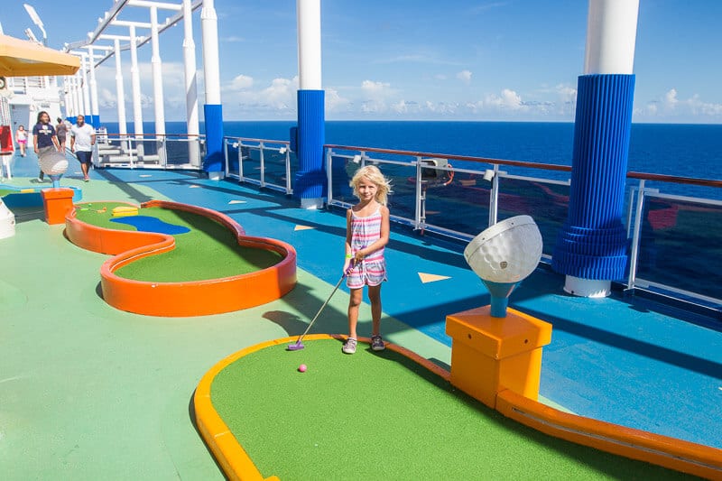 savannah playing mini golf on cruise deck